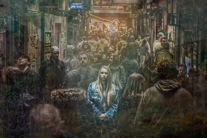 A crowd of people in a street Description automatically generated with medium confidence